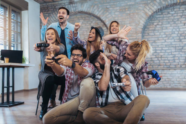 istock Coworkers playing video games in office 1090006858