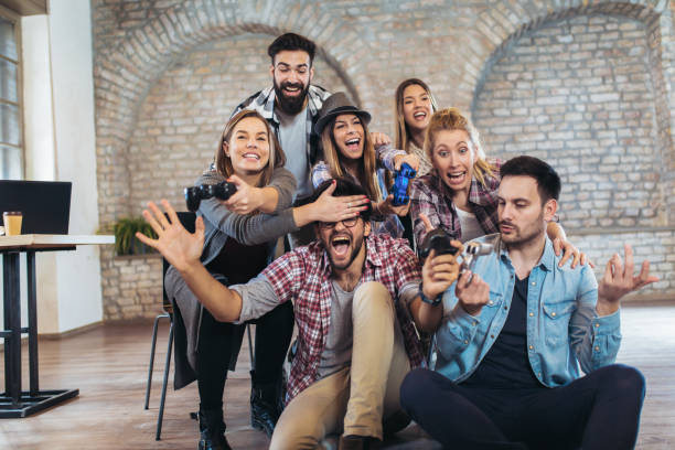 istock Coworkers playing video games in office 1090008014