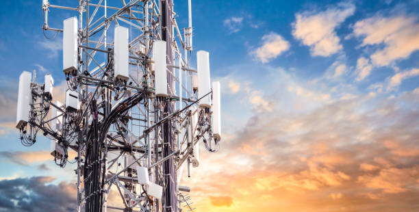 5G Sunset Cell Tower: Cellular communications tower for mobile phone and video data transmission 5G Sunset Cell Tower: Cellular communications tower for mobile phone and video data transmission telecommunications equipment stock pictures, royalty-free photos & images