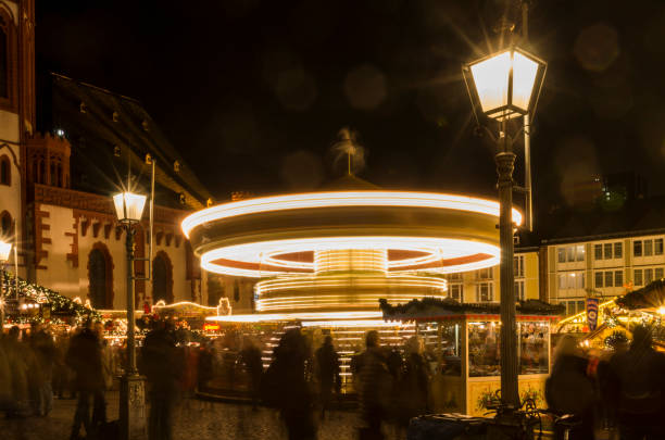 carousel in german christmas market. - frankfurt german culture night city imagens e fotografias de stock