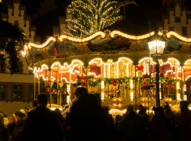 carousel in german christmas market. - frankfurt german culture night city imagens e fotografias de stock