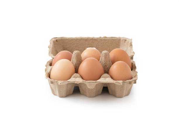 istock Fresh brown eggs in carton on wooden table 1090014322