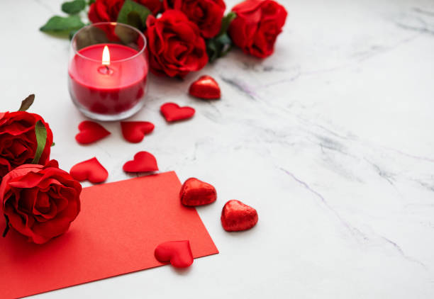 istock Valentines day romantic background - red roses, candle and hearts 1090024128