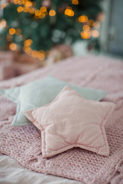 istock bed with pink and gray bedding and star shaped pillows 1090024888
