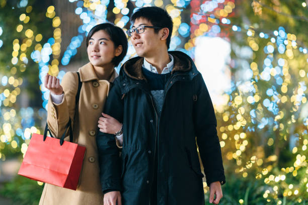 istock Young couple shopping at night 1090026820
