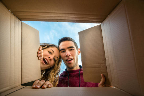istock Young couple opening a parcel 1090030658