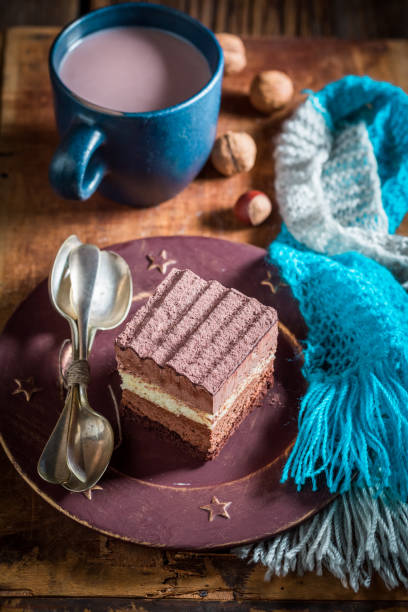 istock Chocolate cake with hot cocoa in winter on wooden table 1090032658