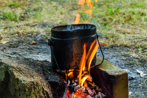 istock Cooking food in a kettle on bonfire 1090036290