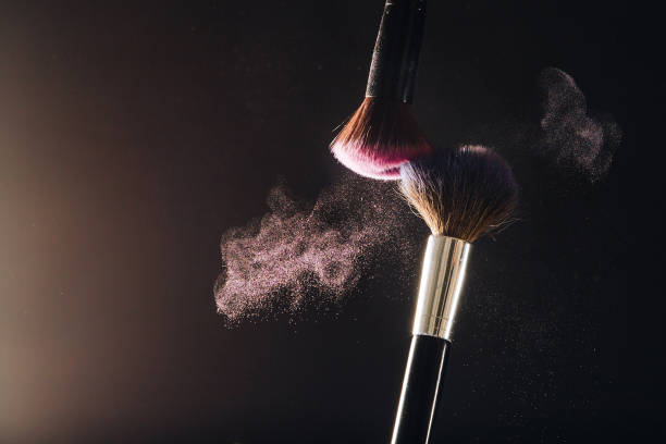Makeup brushes on black background stock photo