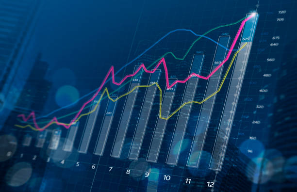 Business growth, progress or success concept. Financial bar chart and growing graphs with depth of field on dark blue background.