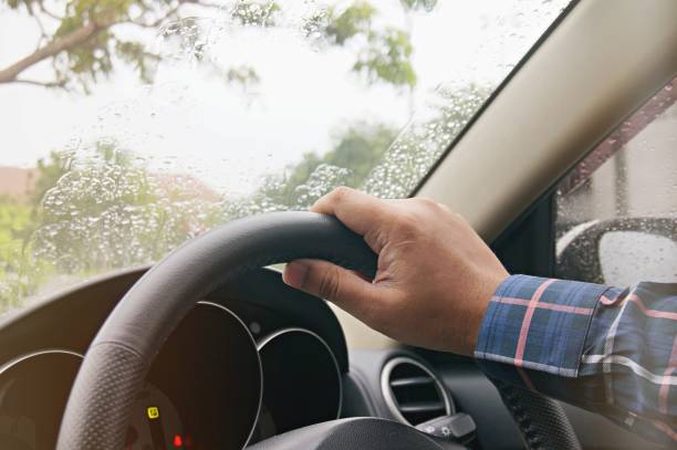 istock Businessman driving with both hands on steering wheel selective focus. safety driving concept. 1090046442