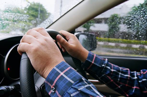istock Businessman driving with both hands on steering wheel selective focus. safety driving concept. 1090046444