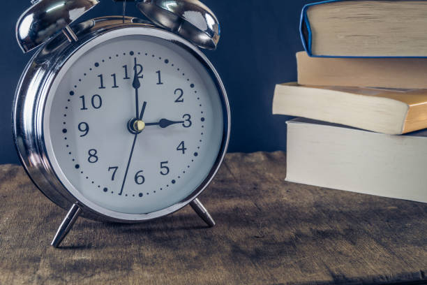 istock alarm clock and books 1090048078
