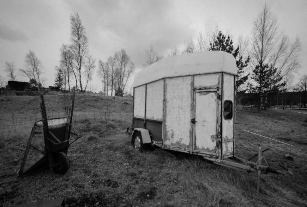 istock Old wheel barrow and horse trailer 1090048332