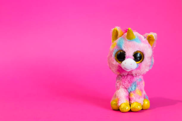 istock Toy Pink Unicorn sits on a pink background 1090056608