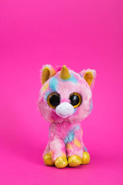 istock Toy Pink Unicorn sits on a pink background 1090056644