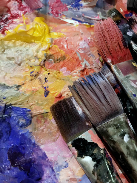 istock Artist palette and brushes 1090060218