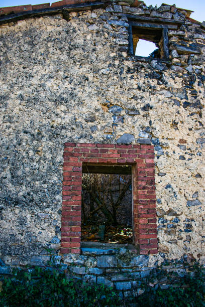 istock windows of abandoned old house in ruins 1090062346