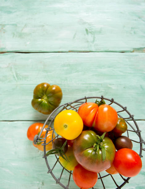 istock colorful organic tomatoes on wooden surface 1090062602
