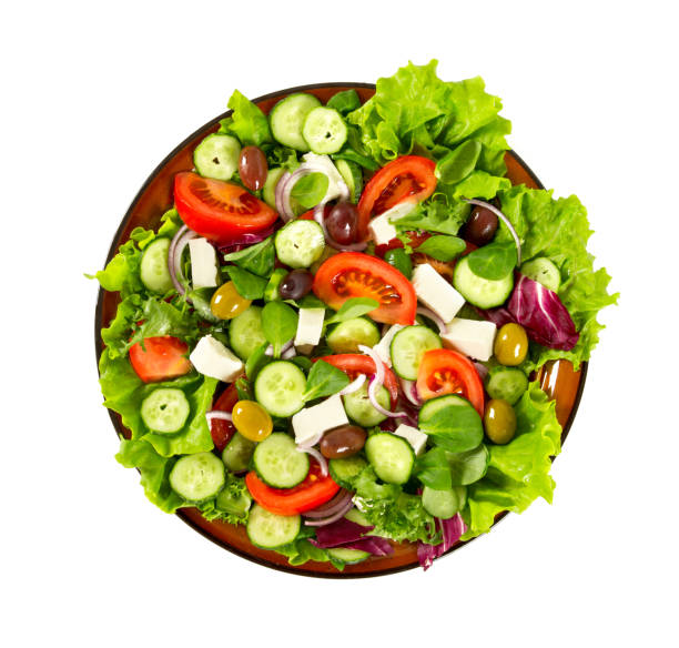 istock greek salad isolated on white 1090062660