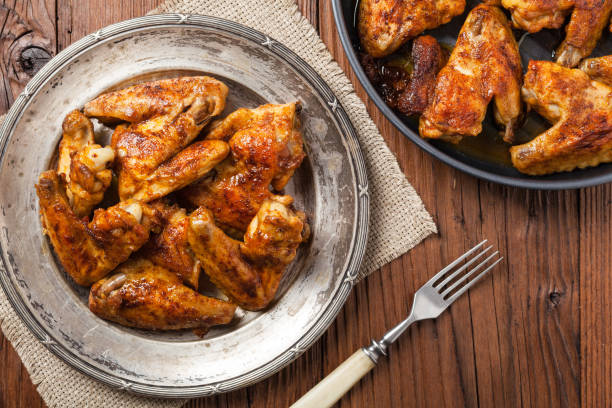 istock Baked wings, served with dip or baked potatoes. 1090064478