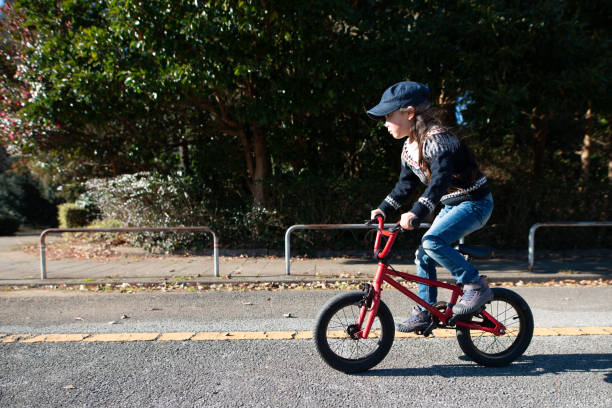 istock Girl playing with bicycle 1090066510