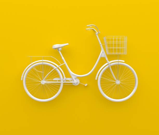 Single retro bicycle painted in monochrome white. Isolated on yellow background. Abstract concept.