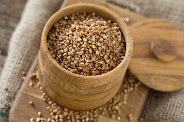 istock buckwheat groats on wooden surface 1090066734