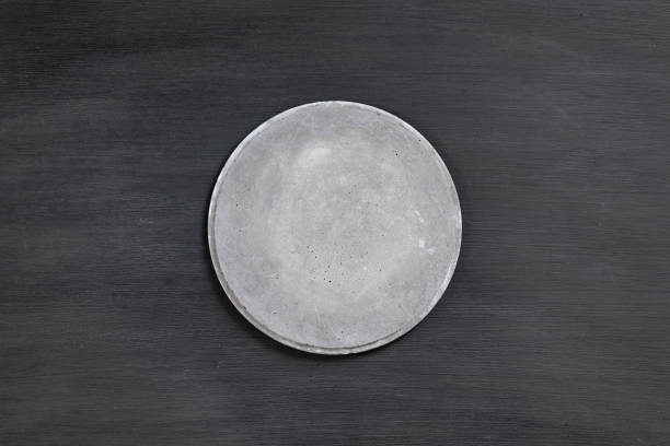 istock grey concrete signboard on dark wooden background 1090069246