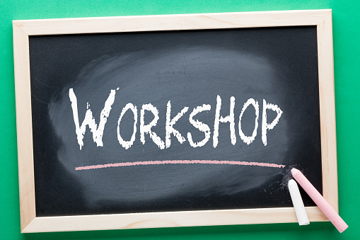 Workshop written on blackboard and color chalks. Education concept.