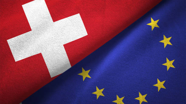 European Union and Switzerland two flags together realations textile cloth fabric texture European Union and Switzerland flag together realtions textile cloth fabric texture swiss culture photos stock pictures, royalty-free photos & images