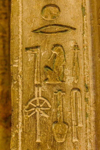 istock Egyptian ancient hieroglyphs on the stone wall 1090080902