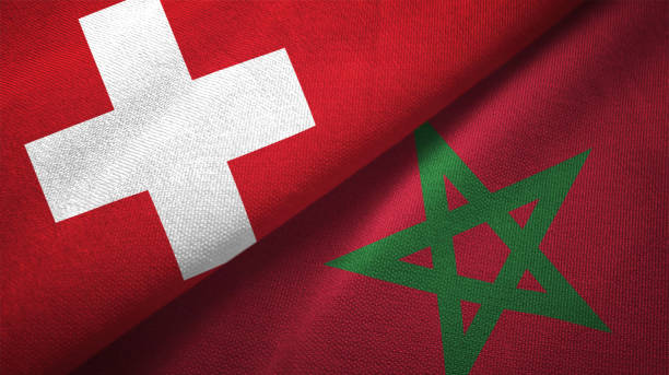 istock Morocco and Switzerland two flags together realations textile cloth fabric texture 1090081128