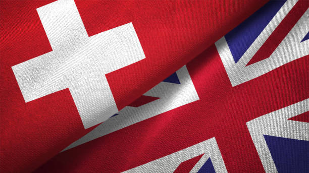 United Kingdom and Switzerland two flags together realations textile cloth fabric texture United Kingdom and Switzerland flag together realtions textile cloth fabric texture swiss flag photos stock pictures, royalty-free photos & images