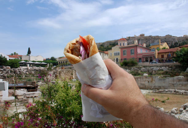 souvlaki street food next to the acropolis. - opa! souvlaki of greece imagens e fotografias de stock