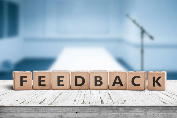 istock Feedback word on wooden cubics in a blue room 1090083512