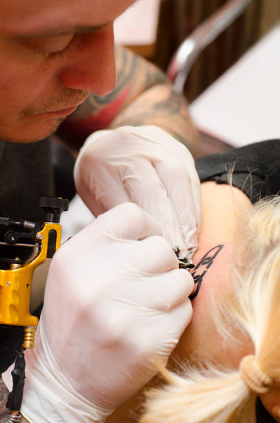 istock Woman getting broken chain tatto 1090083802