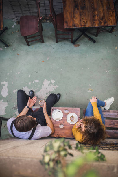 istock Couple sitting in coffee shop 1090084324