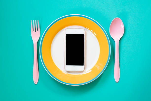 istock mobile phone served on green background, concept and idea of communication 1090085632