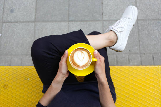 istock Lady's hands holding cup with sth heart-shaped 1090085688