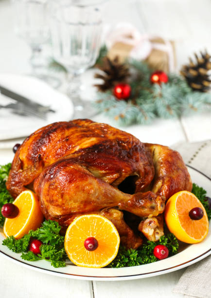 istock Roasted chicken served with citrus and cranberry on plate 1090086570