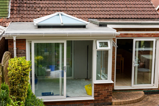 istock The construction of a conservatory nearing completion. 1090087038