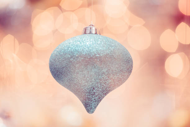 Blue Christmas bauble on white background. Horizontal composition clipping path and with copy space. Front view. Great use as a design element for Christmas related concepts.