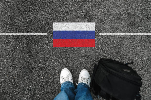 a man with a shoes and flag of Russia stock photo