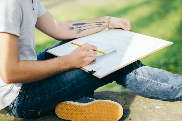 istock College student drawing among nature 1090099478