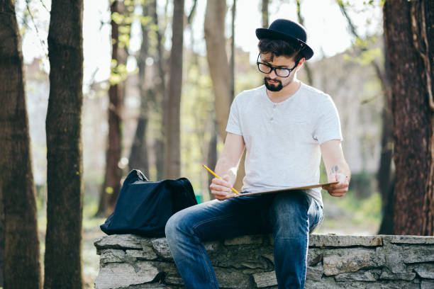 istock College student drawing among nature 1090099706