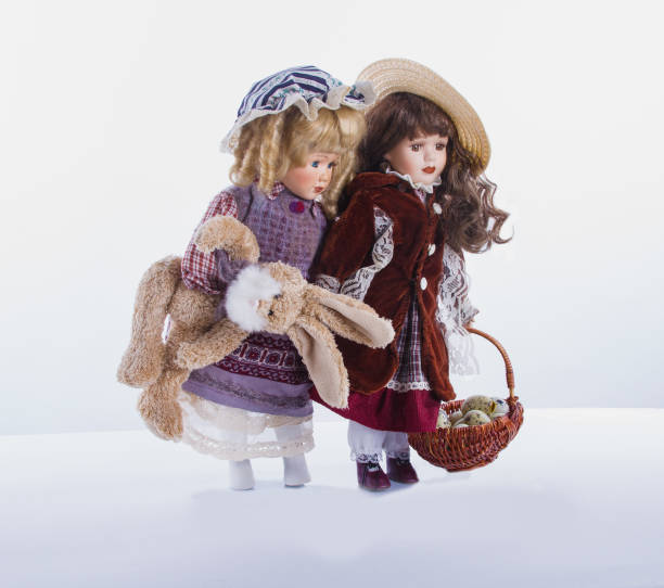 istock Two elegant, vintage dolls walking from  Easter market. 1090100050