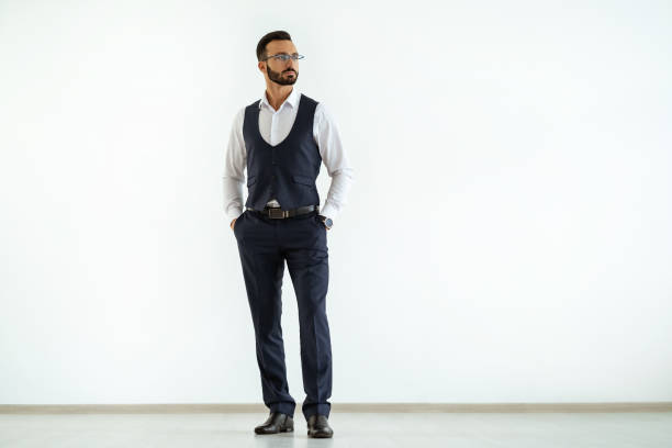 istock The businessman standing on the white background 1090104436