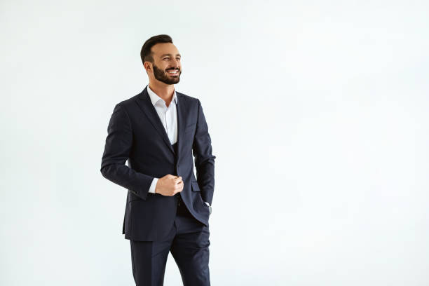 istock The man in a beautiful suit standing on the white background 1090104484