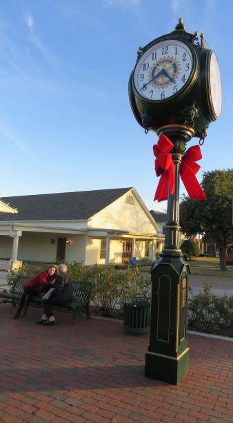 clock in Grapevine, Texas Grapevine, Texas, USA -- December 22, 2018: A historic clock on Main Street in Grapevine, a suburb city of Fort Worth and Dallas, Texas. grapevine texas city stock pictures, royalty-free photos & images
